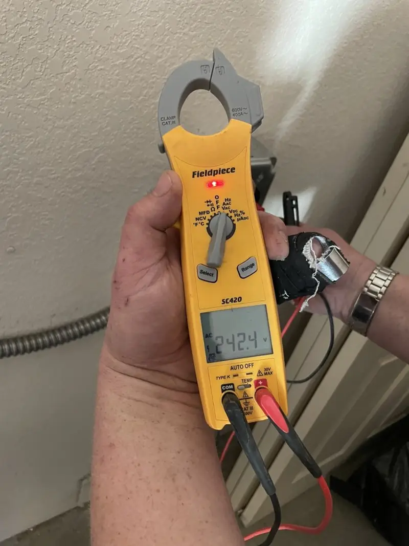 Voltage testing with clamp meter during Ceiling Fan Installation in Athens